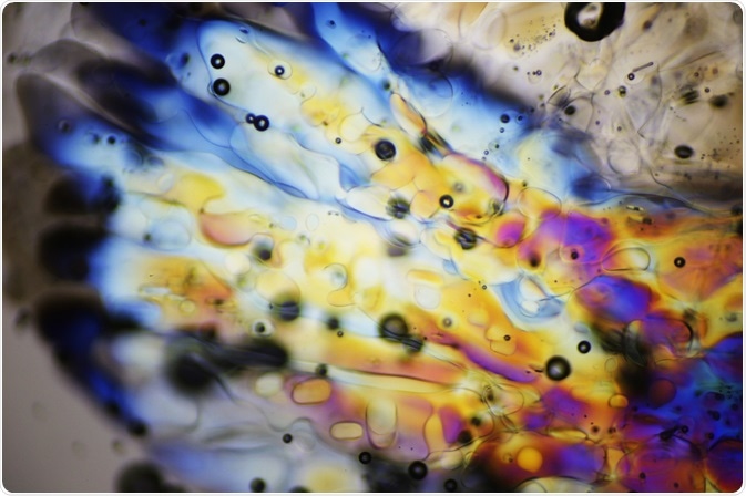 Ice crystals melting under polarized light microscope