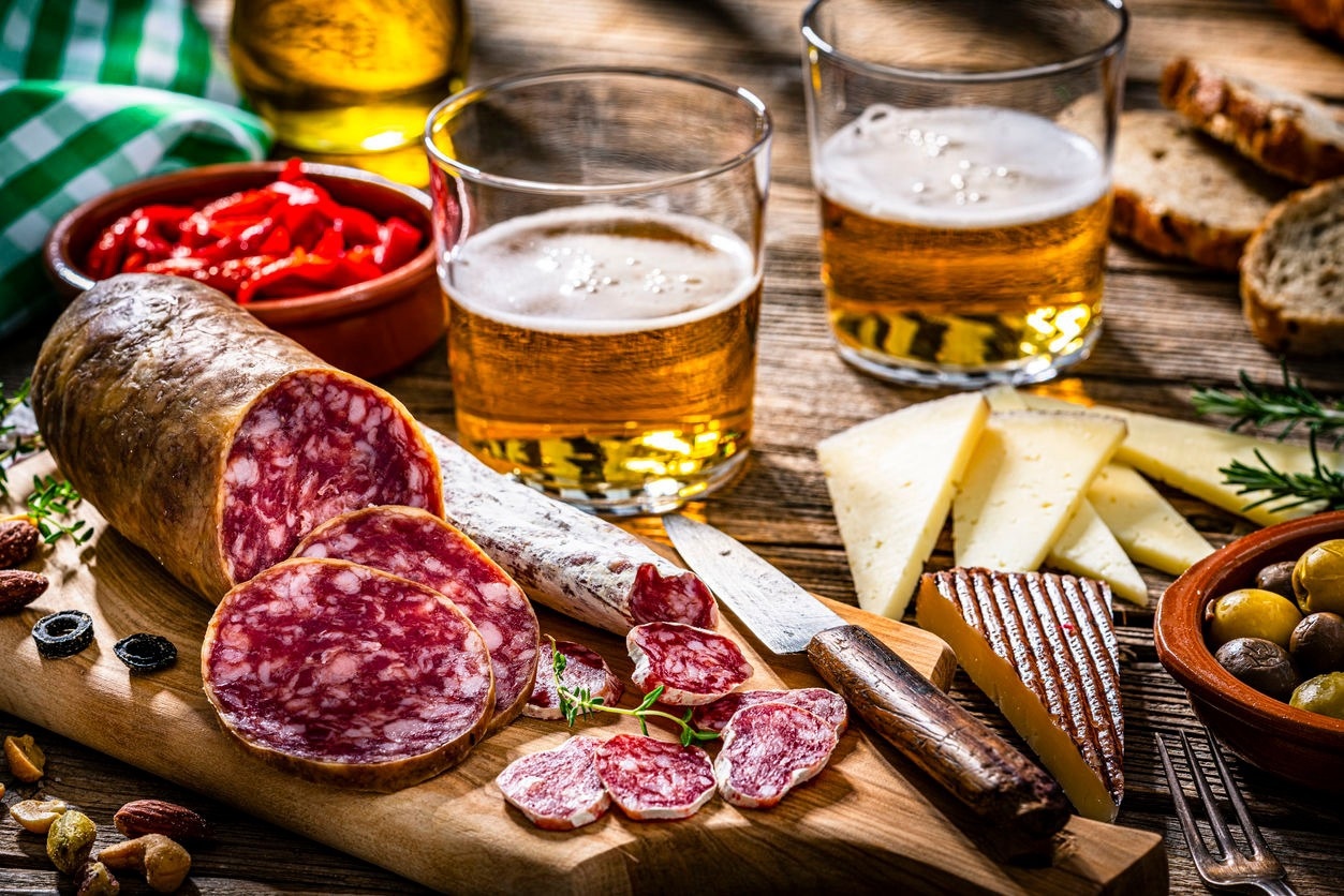 Foods like sausage, cheese, and beer often contain food preservatives derived from naturally produced antibiotics.
